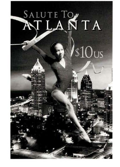 Ad graphic showing woman gymnast leaping over Atlanta city skyline. Copy reads Salute To Atlanta and ten dollars US. Image is black and white.