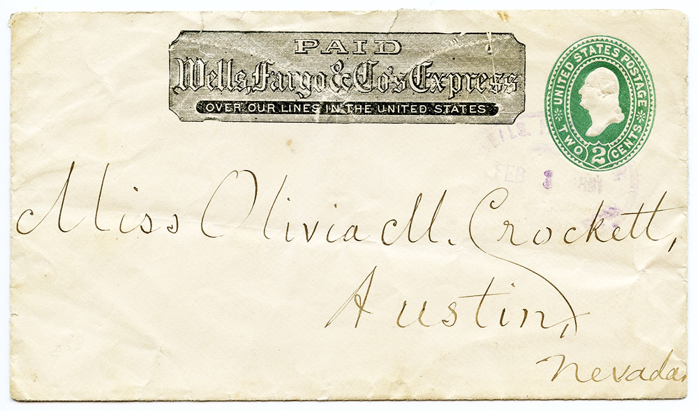 Envelope addressed to Miss Olivia M. Crockett, Austin, Nevada. Imprinted with green 2 cent postage stamp and printed frank that says paid Wells Fargo & Co's Express Paid over our lines in the United States.
