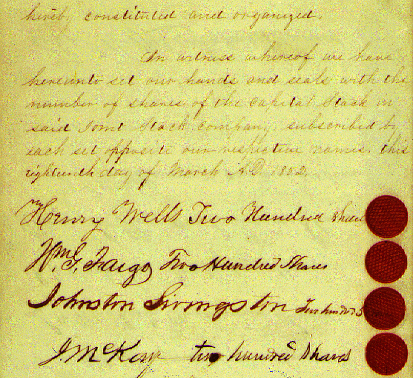 Handwritten document with date of March 18, 1852 above signatures of Henry Wells, William G. Fargo, Johnston Livingston, and J McKaye. Document also records number of shares of stock assigned to each, and has a red wax seal by each name.