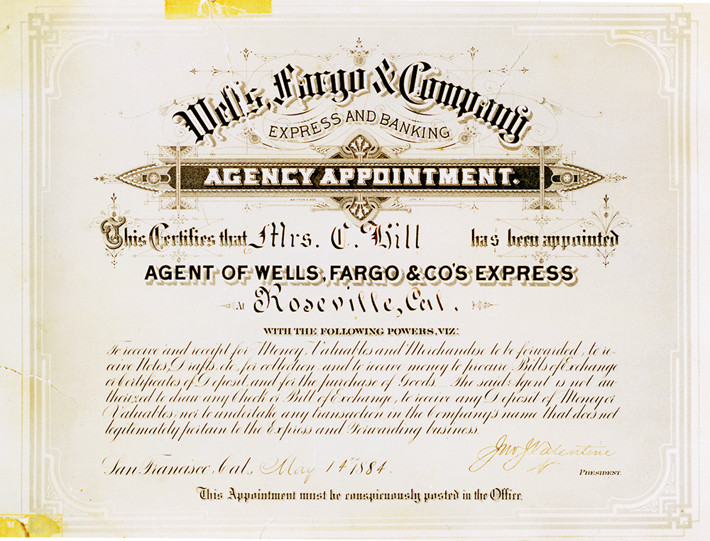 A brown colored certificate-type document reads Wells, Fargo & Company Express and Banking, Agency appointment. Handwritten entries certify Mrs. C. Hill has been appointed agent of Wells Fargo & Co's Express at Roseville, California. Small print detailing agent's duties follows. Image is color.