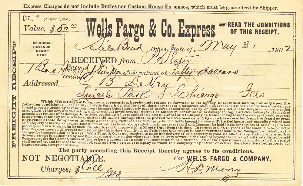 Yellow document with black ink. Wells Fargo freight receipt dated May 31, 1902 from Gila Bend, Arizona. Lists gila monster boxed for shipment to Chicago, valued at $50. Signed by local Wells Fargo agent.