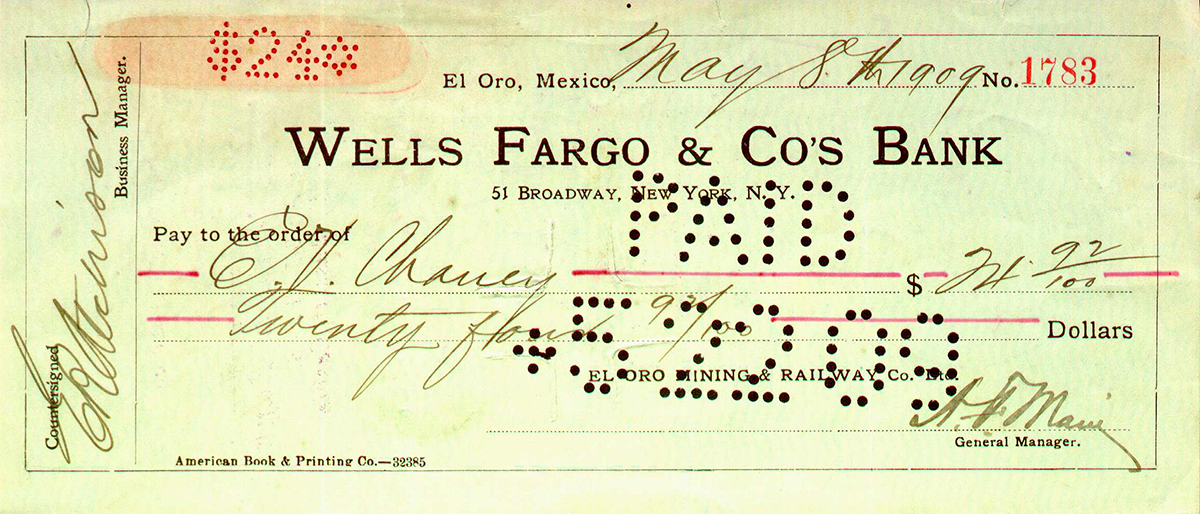 Bank check drawn on Wells Fargo & Co's Bank, 51 Broadway, New York for sum of $24.92 and dated May 7, 1909. A series of holes punched through the paper spell word paid, cancelling the check.