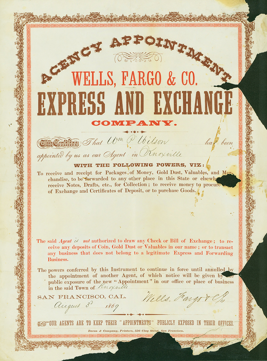 A printed poster-like certificate reads Agency Appointment Wells Fargo & Co. Express and Exchange Company. Reads in part this certifies that William P. Wilson has been appointed by us as our agent in Knoxville. Wilson's name and location is handwritten in ink. Certificate continues with small print outlining duties of agent. Some pieces of document are missing in lower right corner. Red and black ink on cream white paper.