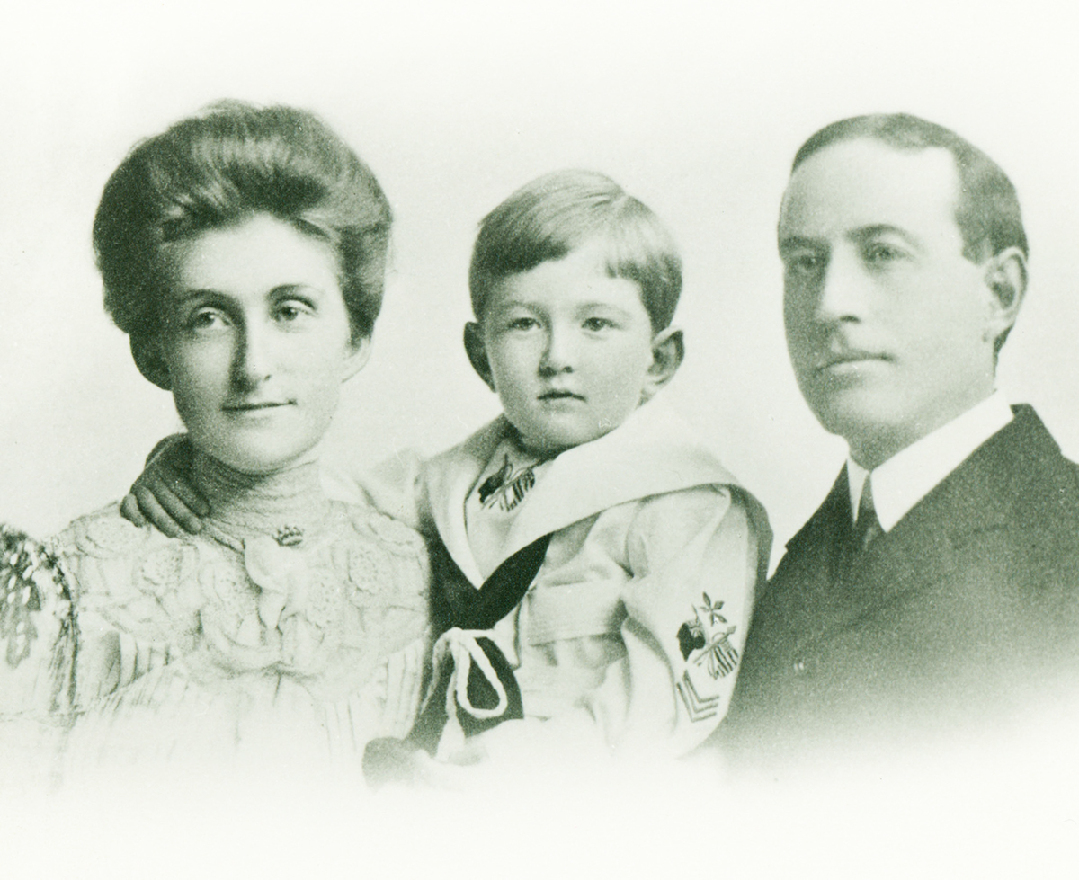 Family portrait of Clara Hellman Heller with her son, Ed Heller, and husband, E. S. Heller.