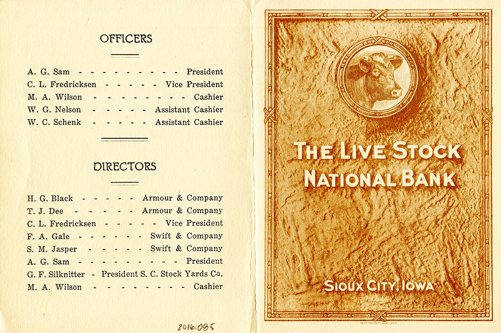 Opened brochure. The left side has a list of names and positions of people in the bank. The right includes a drawing of a cow in a circle and the words: The Live Stock National Bank, Sioux City, Iowa.