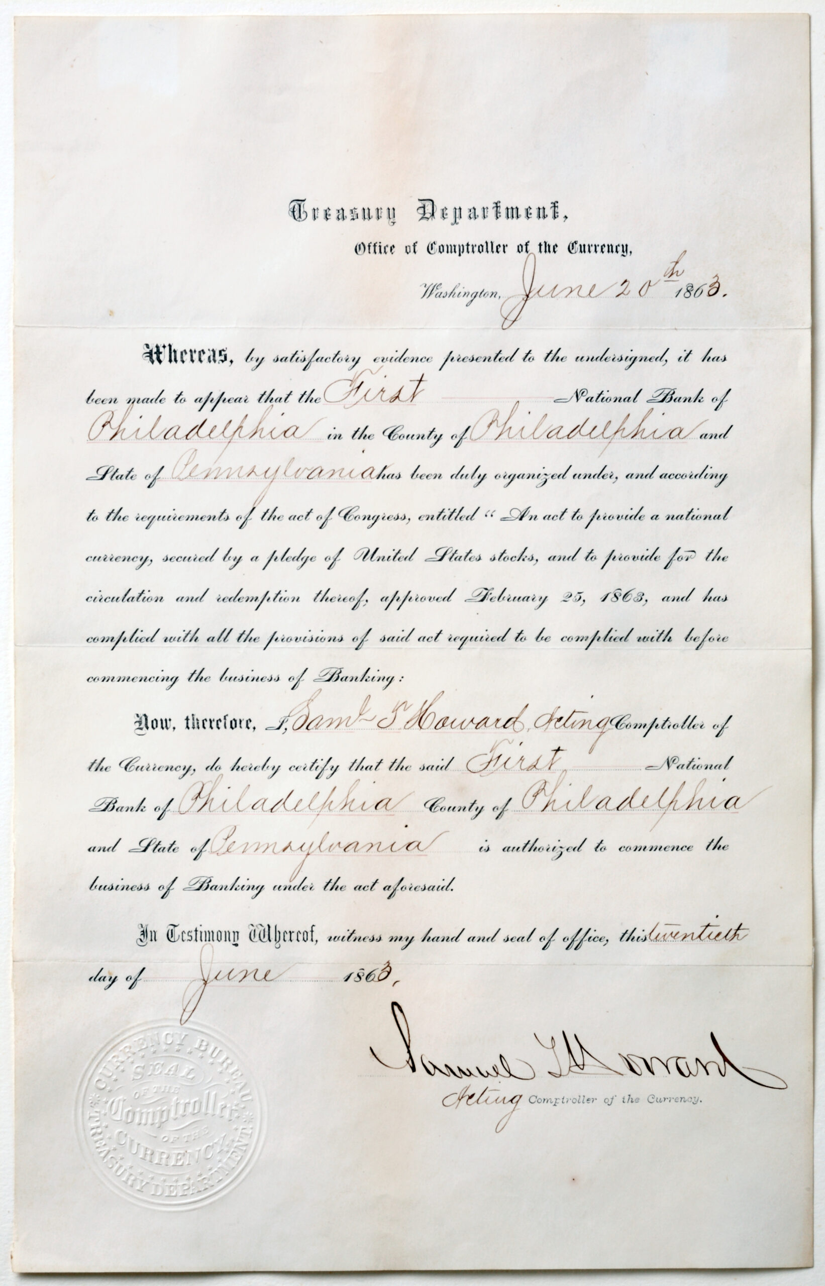 A white document with black lettering that reads: Treasury Department Office of the Comptroller of Currency Washington, June 20th 1863.