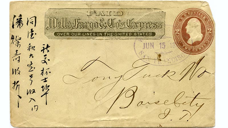 A historic envelope cover stamped: Paid Wells, Fargo & Co’s Express Over our lines in the United States. The envelope features Chinese writings on the left margin. Image link will enlarge image.