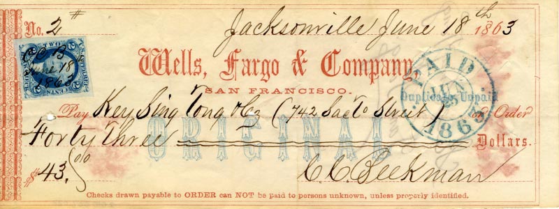 A yellow Wells, Fargo & Company check with red lettering, made out to a Chinese customer for $43 in 1863. Image link will enlarge image.