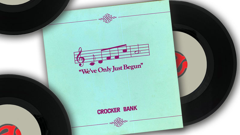 A teal album cover with an illustration of a music bar and notes titled “We’ve Only Just Begun”. Three black vinyl records are lying near cover.