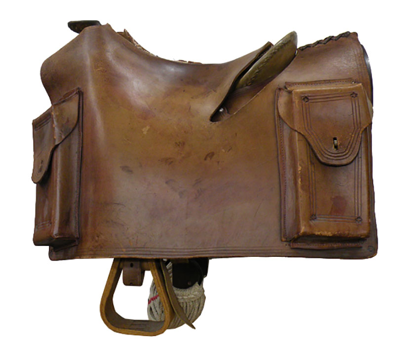A leather saddlebag with two large pockets at both the front and back.