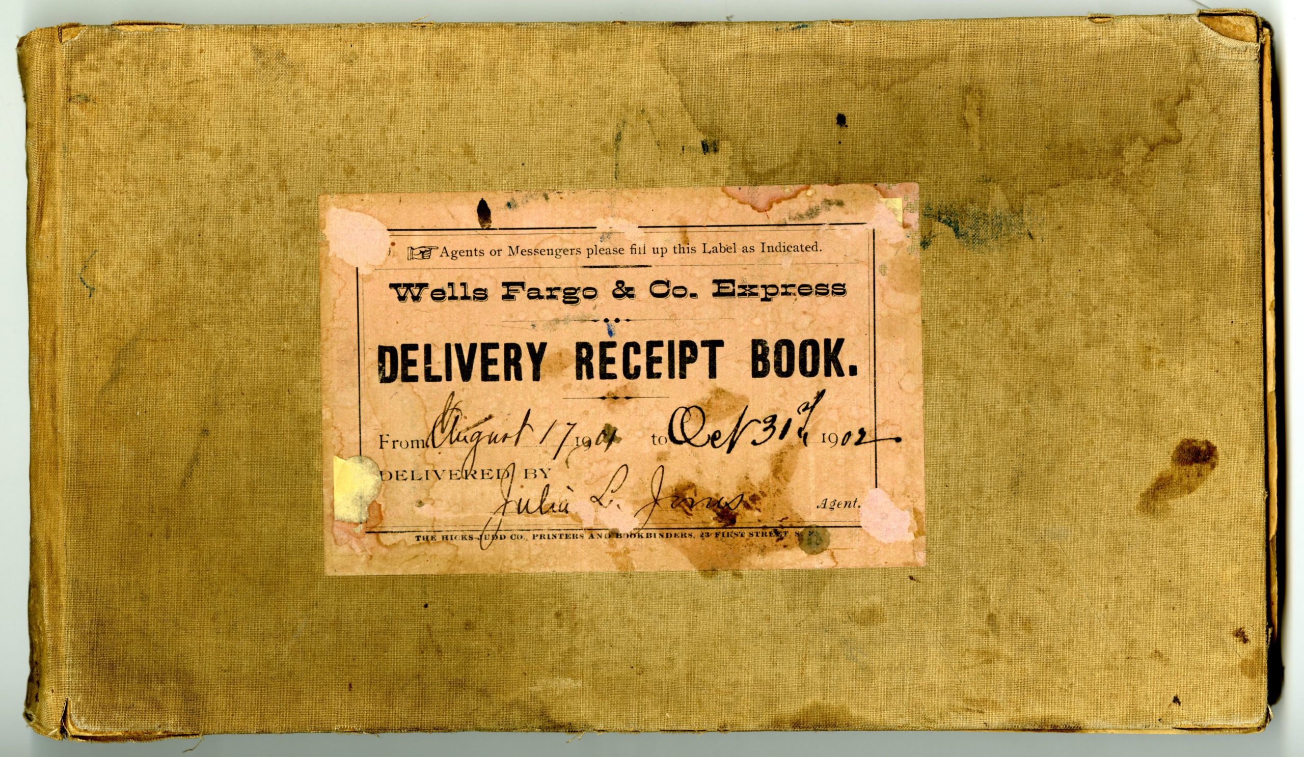 An aged and yellowed book is opened to a page that says: Received of Wells Fargo & Company Express at their office in 1901 in good order, the following Articles set opposite our respective names. There are handwritten entries below.